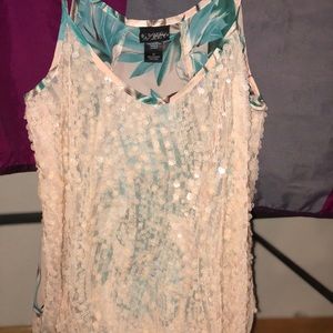 Women’s sheer/sequined dressy tank top.
